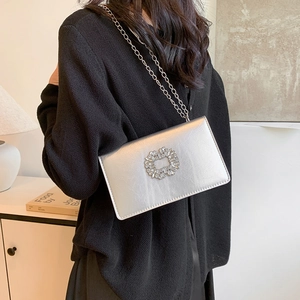 Silver metallic crossbody bag with crystal flower buckle and thin chain strap