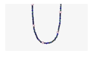 Close-up of faceted lapis lazuli beads and irregular purple freshwater pearls necklace