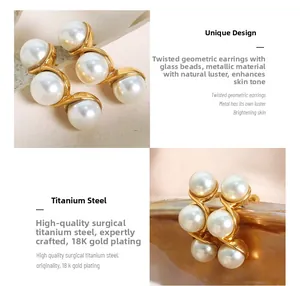 Detailed view of 18K gold plated titanium earrings with twisted geometric pods and white pearls