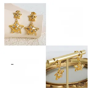 Detail of 18K gold plated titanium steel star earrings with micro-inlaid zircons