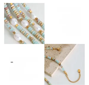 Detail of baroque pearls and natural stones on an 18K gold-plated titanium chain