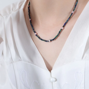 Bohemian choker with blue lapis beads and freshwater pearls on a female model