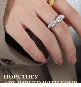 Polished silver and 18k gold bubble bean rings shown on a hand for a minimalist style