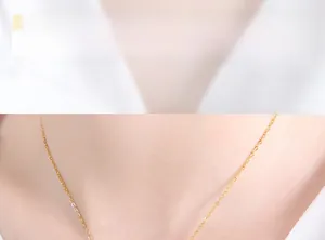 Close-up detail of a minimalist gold pendant necklace featuring a refined chain design