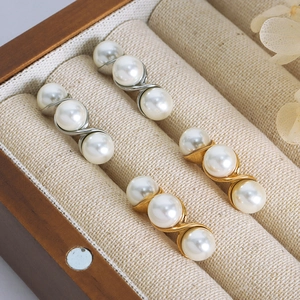 Elegant gold and silver titanium steel earrings with triple white pearls in S-curve design