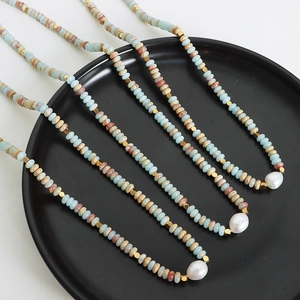 Bohemian colorful stone and freshwater pearl necklace with titanium steel hardware on black plate