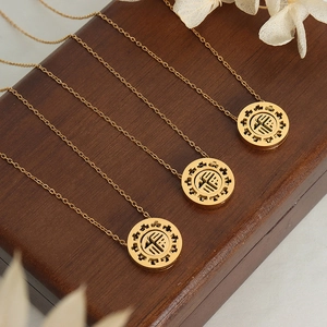 18K gold plated necklace with circular Fu character pendant and hollow geometric design
