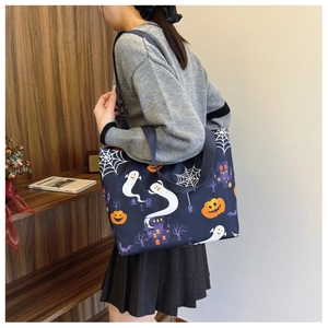 Macro shot of Halloween tote bag showing ghost and pumpkin prints on durable fabric
