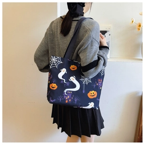 Detailed view of the large capacity Halloween tote bag with ghost and pumpkin prints