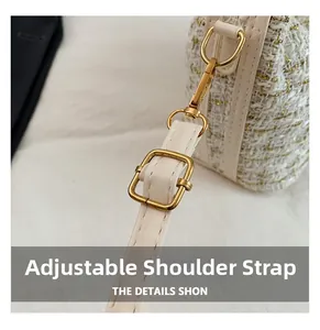 Detail of adjustable strap buckle on beige tweed crescent bag with gold metallic threads