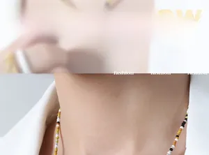 Detail of beaded necklace with natural pearls and titanium steel on model showcase