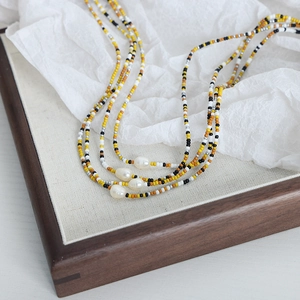 Handmade beaded necklace with colorful glass seed beads and baroque freshwater pearls