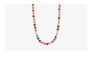 Detail of multi-colored faceted jasper bead necklace with gold spacers in U-shape