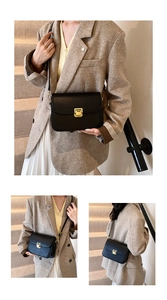 Detail of black leather crossbody bag featuring gold square push-lock and flap closure