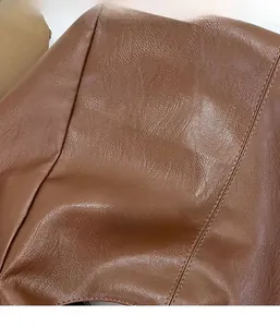 Detail of premium PU leather shoulder bag showing pebble grain texture and neat stitching