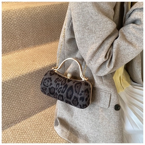 Chic leopard print evening clutch with gold metal handle and rhinestone clasp detail