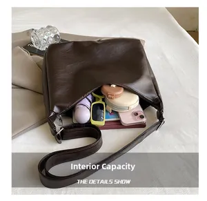 Top view of large brown tote bag interior showing capacity for daily essentials