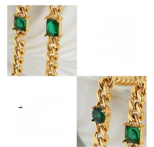 Detail of 18K gold plated thick chain necklace featuring a large emerald green zircon stone