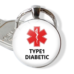 Round medical alert keychain featuring red Star of Life and Type 1 Diabetic text