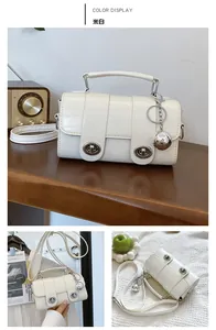 Detail shots of off-white crocodile embossed small square bag with double retro locks