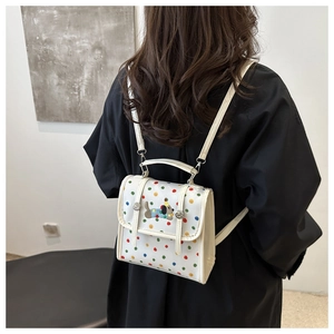 White polka dot mini backpack with cute dog embroidery and adjustable straps for women
