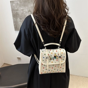 Cute polka dot backpack with cartoon dog embroidery and adjustable shoulder straps