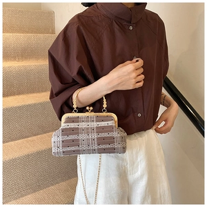 Retro plaid shell bag with bamboo handles, lace trim and polka dots shown in use