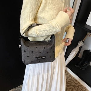 Chic grey polka dot shoulder bag with black leather strap and rich rabbit logo