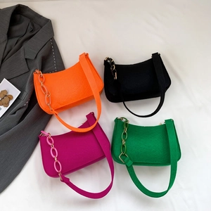 Chic croc-embossed underarm bags in orange, black, purple, and green with chain detail
