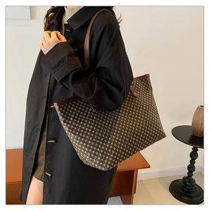 Chic retro geometric pattern tote bag shown in a minimalist indoor lifestyle setting