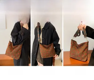 Brown corduroy strawberry tote bag shown in shoulder, crossbody and handbag styles