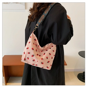 Pink corduroy strawberry bucket bag with vintage ethnic style woven wide shoulder strap
