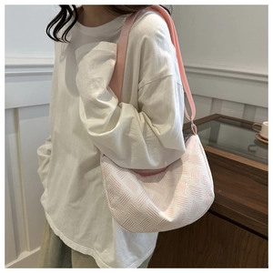 Pink and white geometric textured woven tote bag with a matching wide shoulder strap