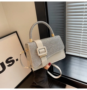 Detail of silver sequin crossbody bag with square buckle and smooth PU patchwork design