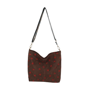 Brown corduroy bucket bag with red strawberry print and wide adjustable shoulder strap
