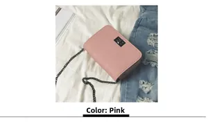 Detailed close-up of pink chain bag texture with metallic square twist lock and silver strap