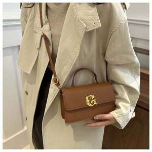 Brown litchi grain leather square handbag with golden engraved G buckle and shoulder strap