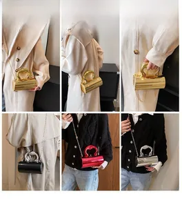 Mini acrylic box bags in gold, silver, black, and red shown with heart handles and chains