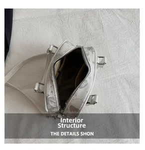 Interior structure of the white printed handbag showing internal pockets and storage space