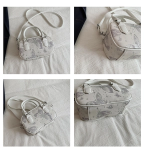 Detailed views of white handbag with grey butterfly and star patterns from four angles
