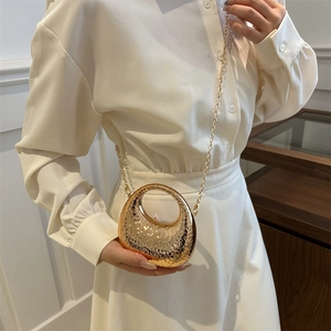 Golden round hammered metal evening clutch bag with chain strap for women