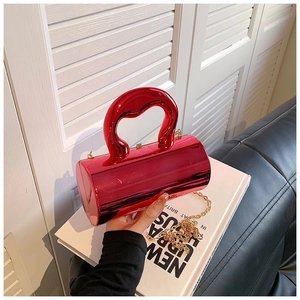 Mirror red cylindrical acrylic box bag with chunky handle and elegant gold chain strap