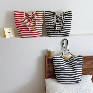 Minimalist striped canvas tote bag in red and black colors for casual shoulder wear