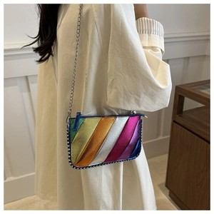 Detail view of rainbow metallic crossbody bag with silver studs and chain strap