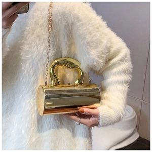 Golden mirror cylindrical acrylic handbag with elegant top handle and metal chain strap