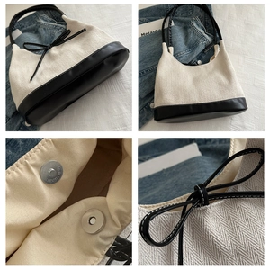 Detail shots of canvas tote bag with black bow, leather handles, and magnetic closure