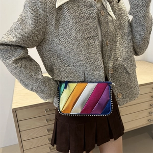 Chic rainbow striped crossbody bag with metallic chain strap and silver bead trim