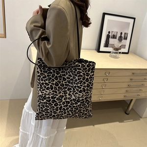 Chic large capacity leopard print canvas tote bag with slim black shoulder straps