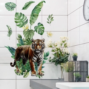 Realistic tiger wall sticker with tropical monstera leaves in a modern bathroom decor