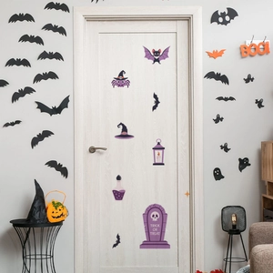 Detail showing various Halloween wall stickers including bats, ghosts and a tombstone